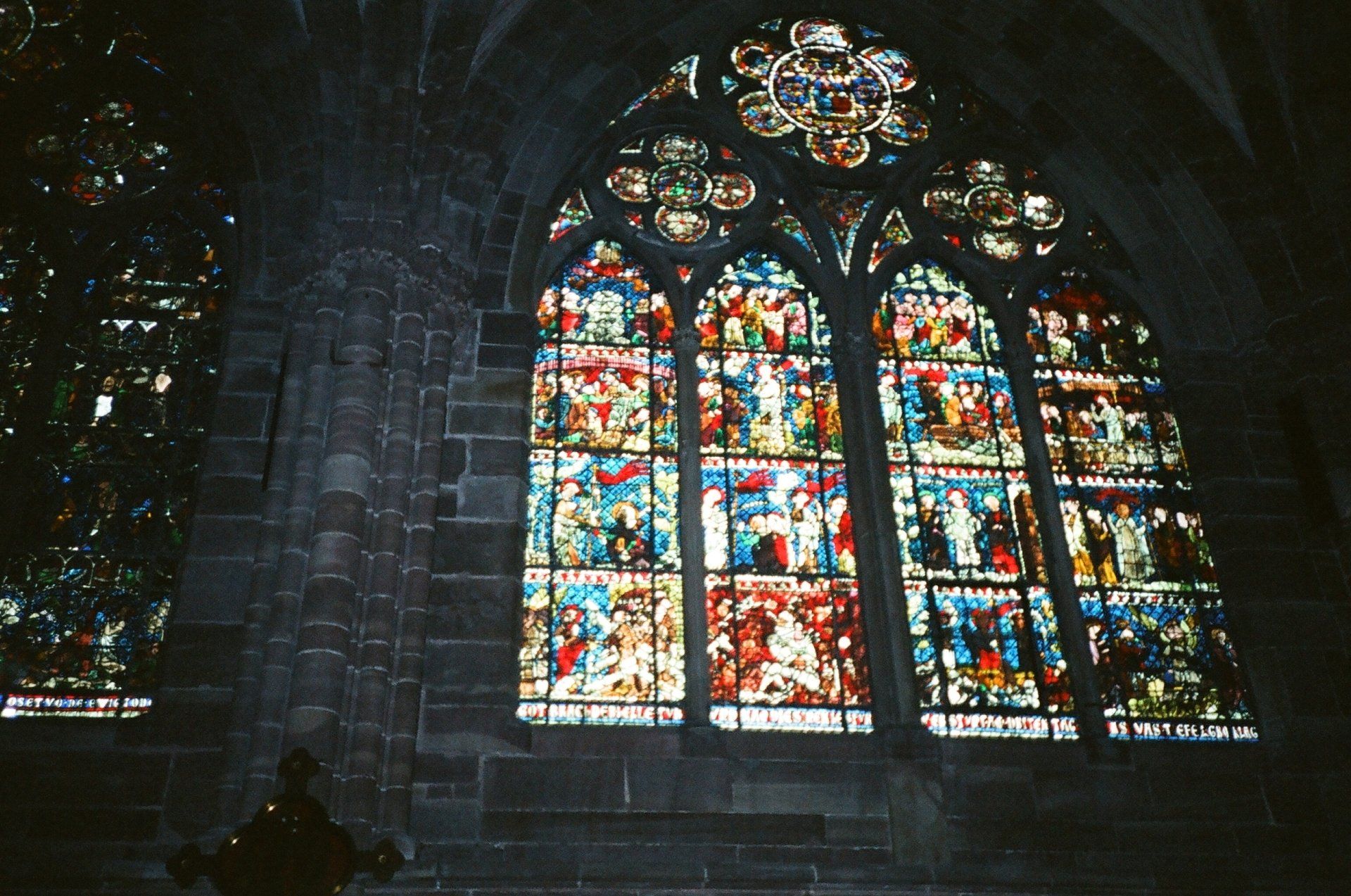 A large stained glass window in a church