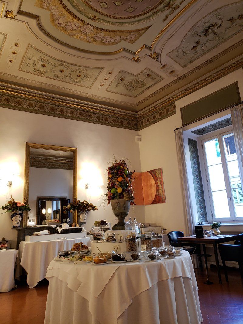A room with tables and a mirror on the ceiling