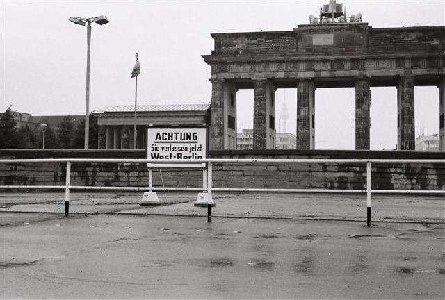 A black and white photo of a sign that says achtung