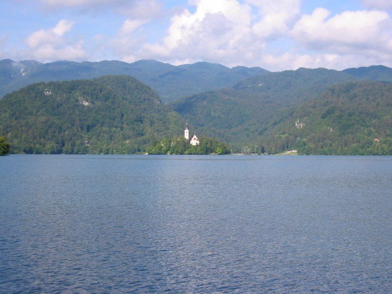 A large body of water with mountains in the background
