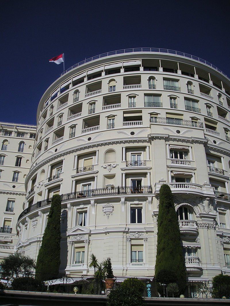 A large white building with a flag on top of it