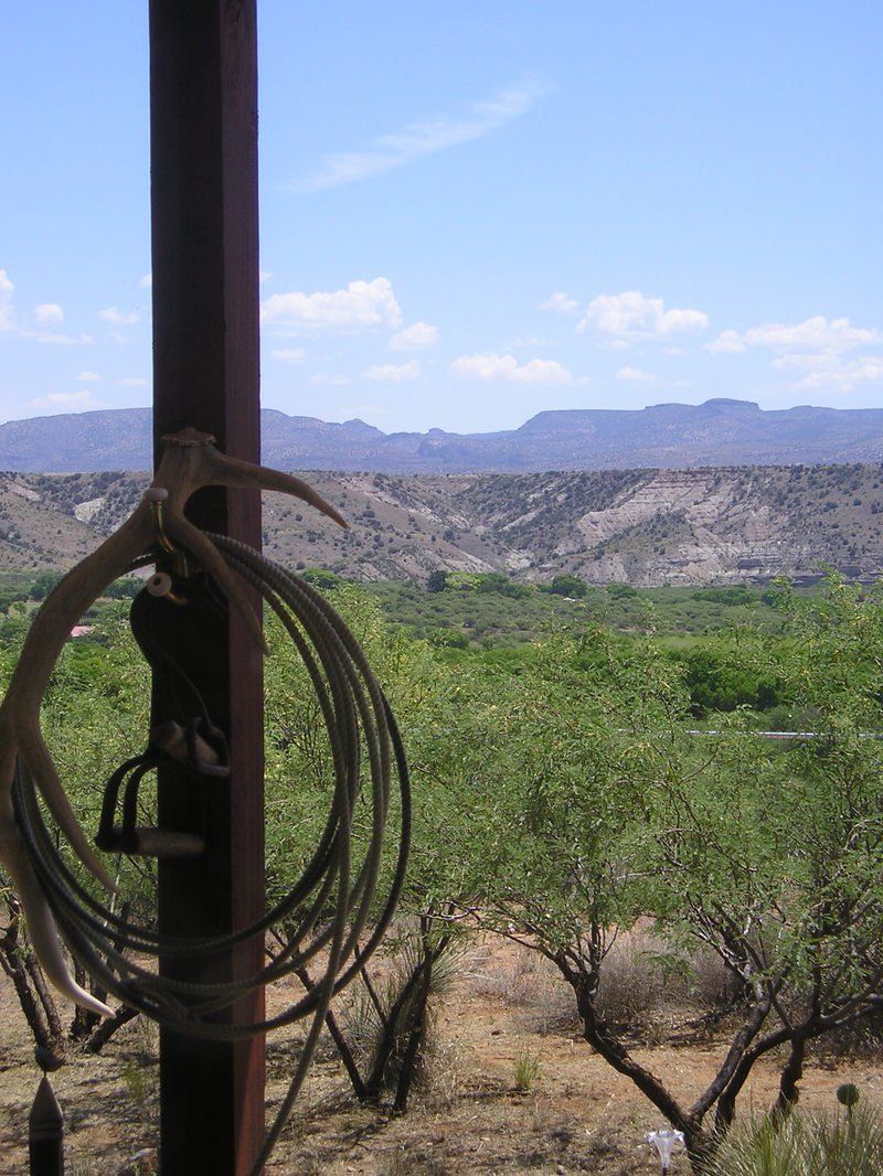 A rope is hanging from a pole in the desert