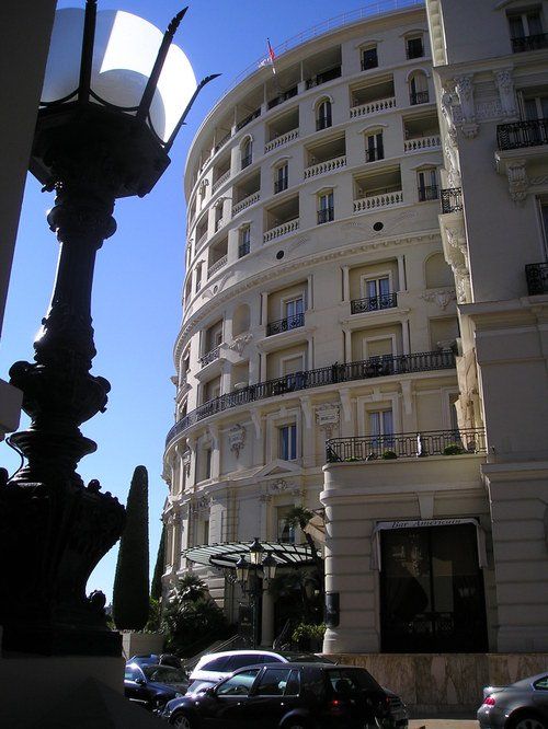 A large building with cars parked in front of it