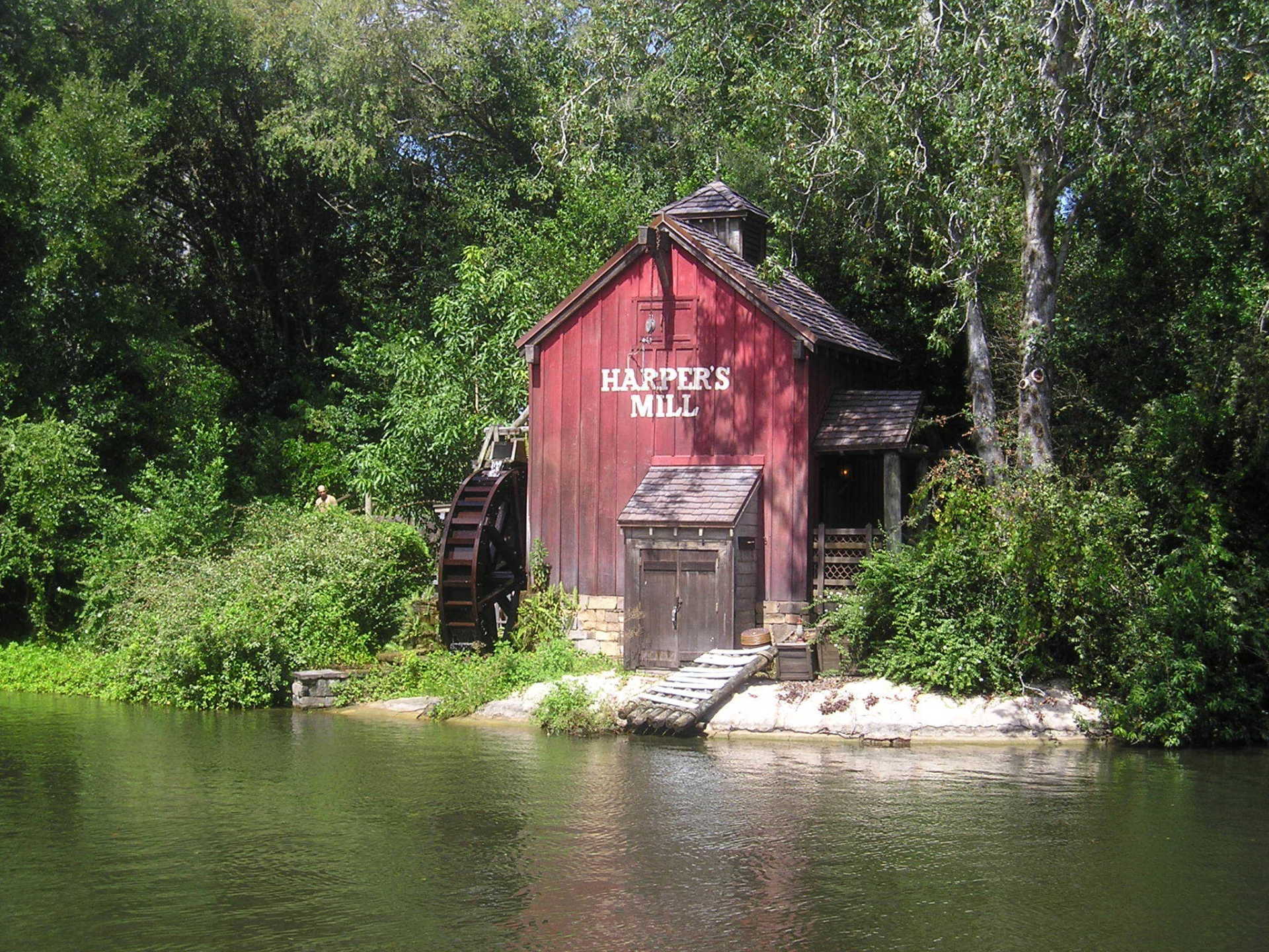 The harper 's mill sits on a small island in the middle of a river