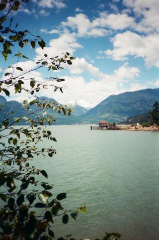 A large body of water with mountains in the background