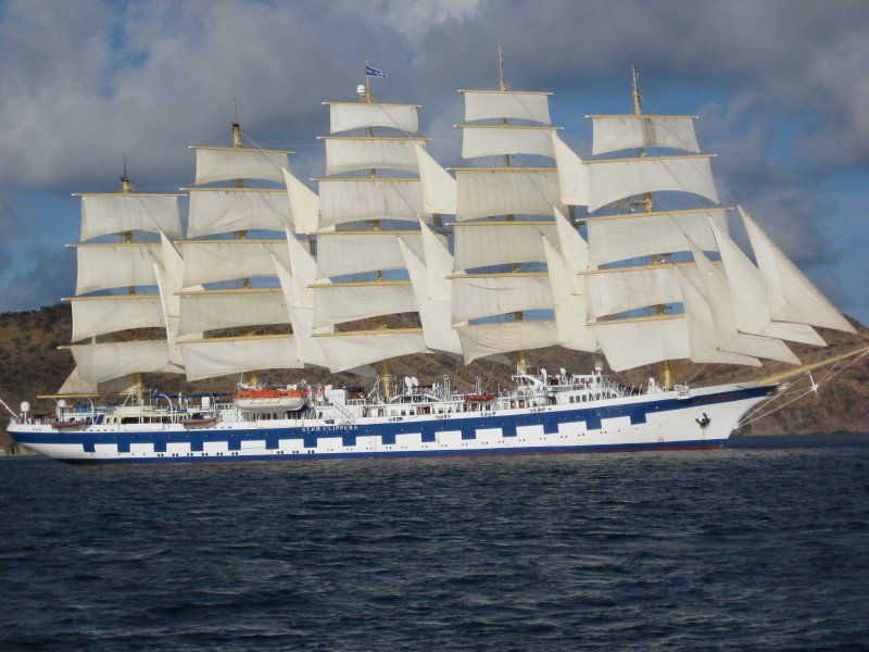 A large sailboat is in the middle of the ocean