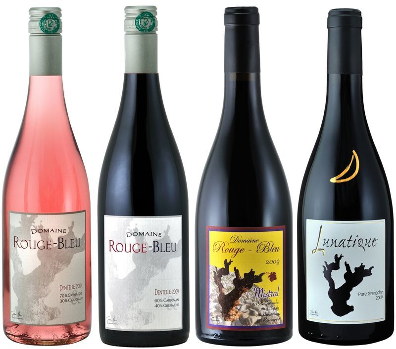 Four bottles of wine one of which is called rouge bleu