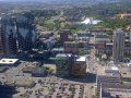 An aerial view of a city with lots of buildings and trees.