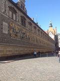 A large building with a lot of paintings on the side of it.