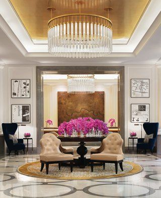 There is a large chandelier in the middle of the room.