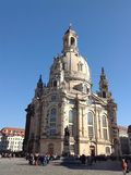 A large building with a dome on top of it.