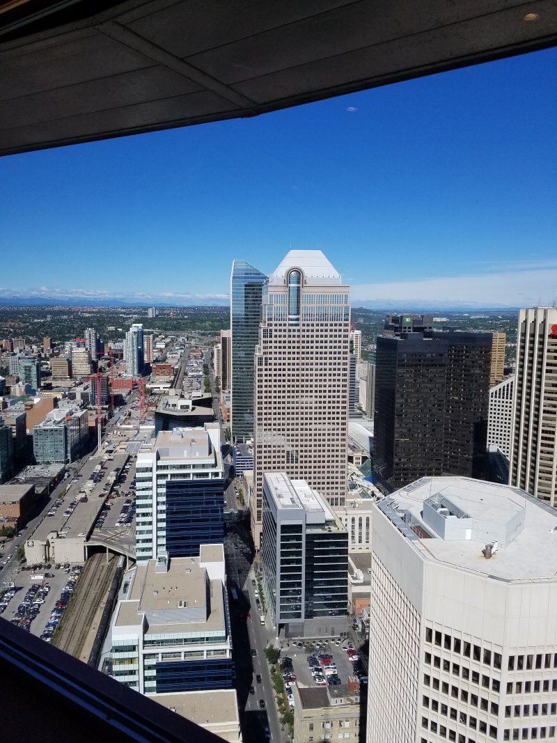 An aerial view of a city skyline on a sunny day