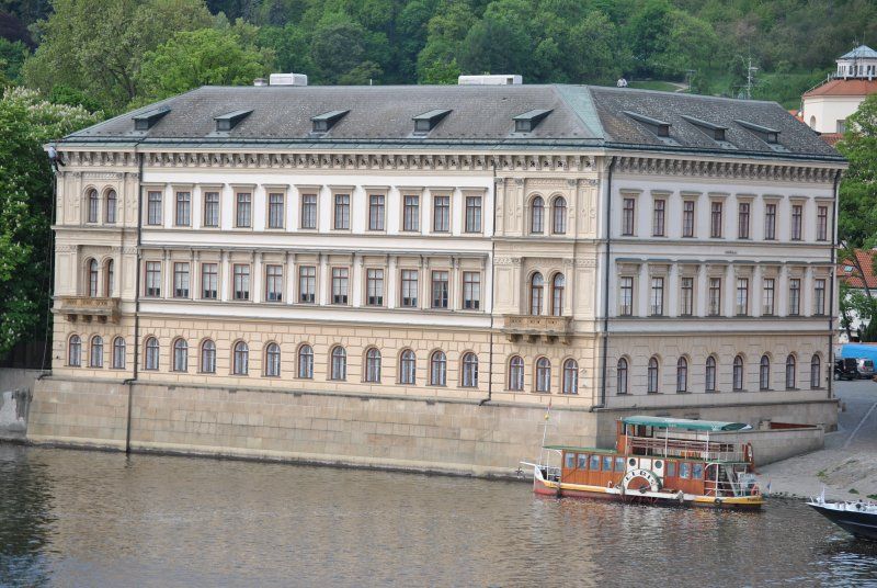 A large building with a boat in front of it