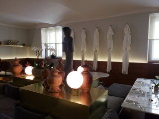 A room with a table and vases on it