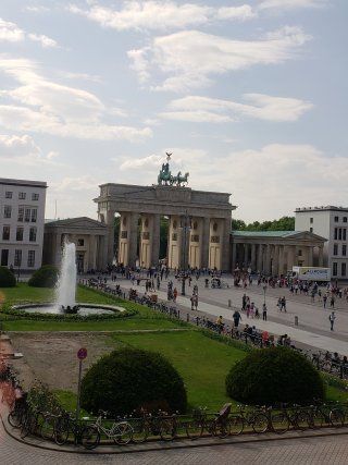 A large building with a fountain in front of it