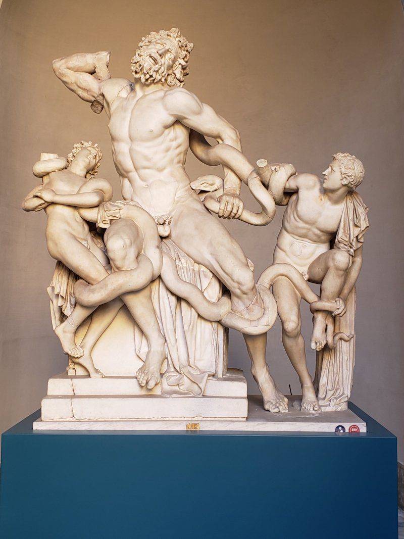 A statue of a man with a snake around his neck