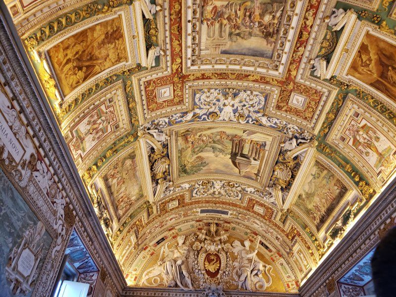 A ceiling with a lot of paintings on it