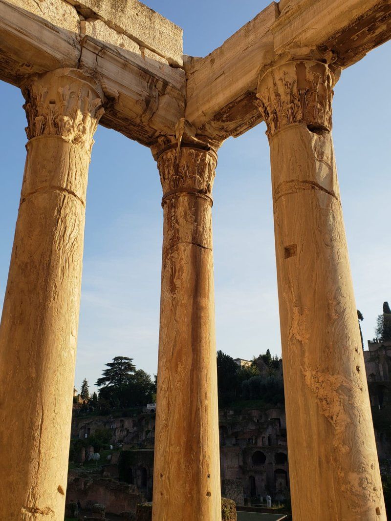 A row of columns with a blue sky in the background