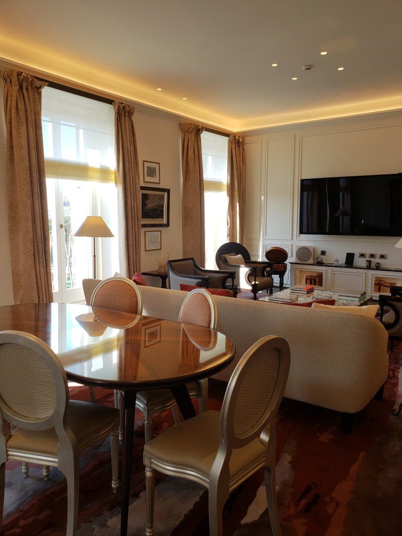 A living room with a table and chairs and a couch