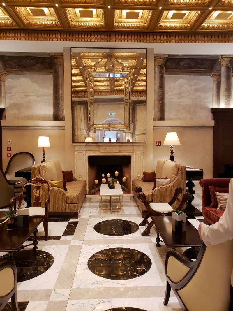 A living room with lots of furniture and a fireplace
