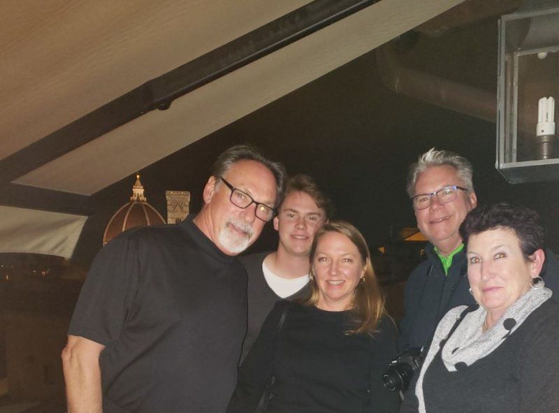 A group of people posing for a picture in a dark room