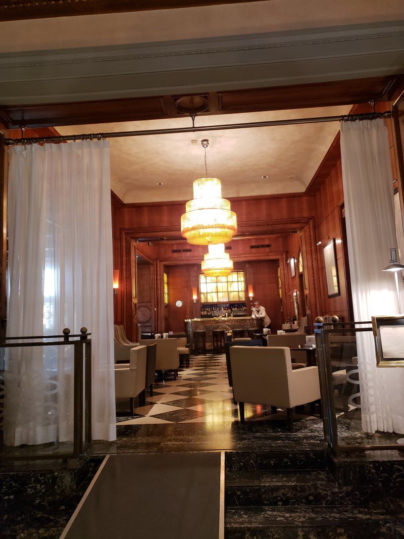 A large room with a lot of furniture and a chandelier