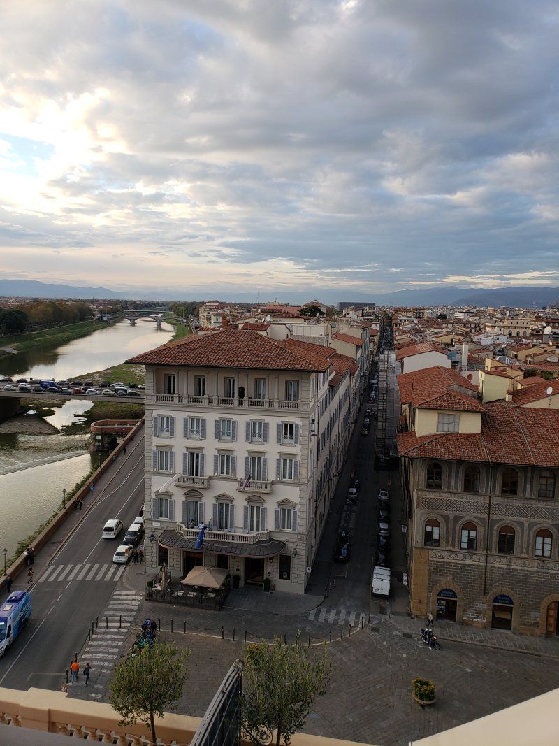 An aerial view of a city with a river in the background