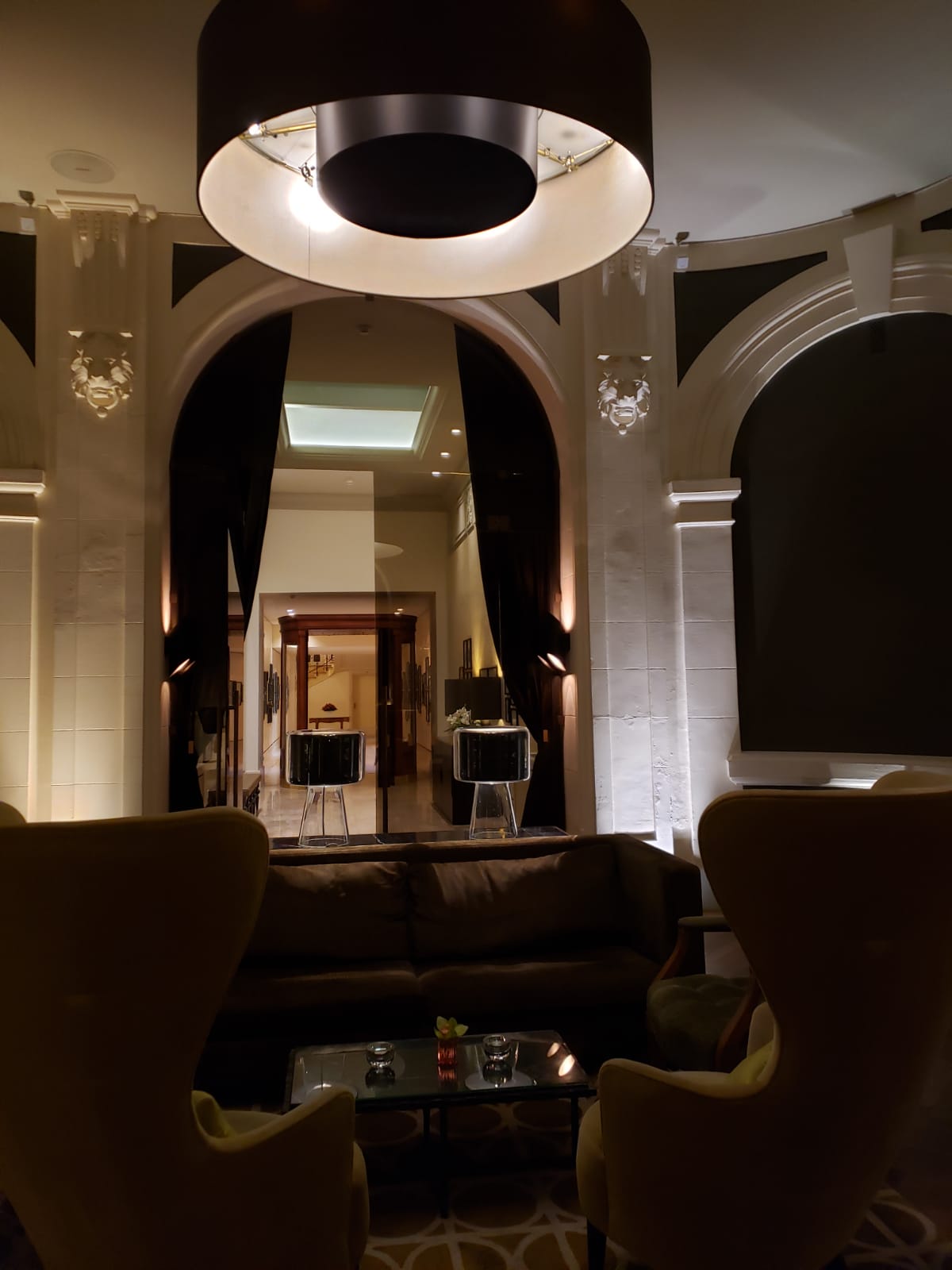 A living room with a couch and chairs in it