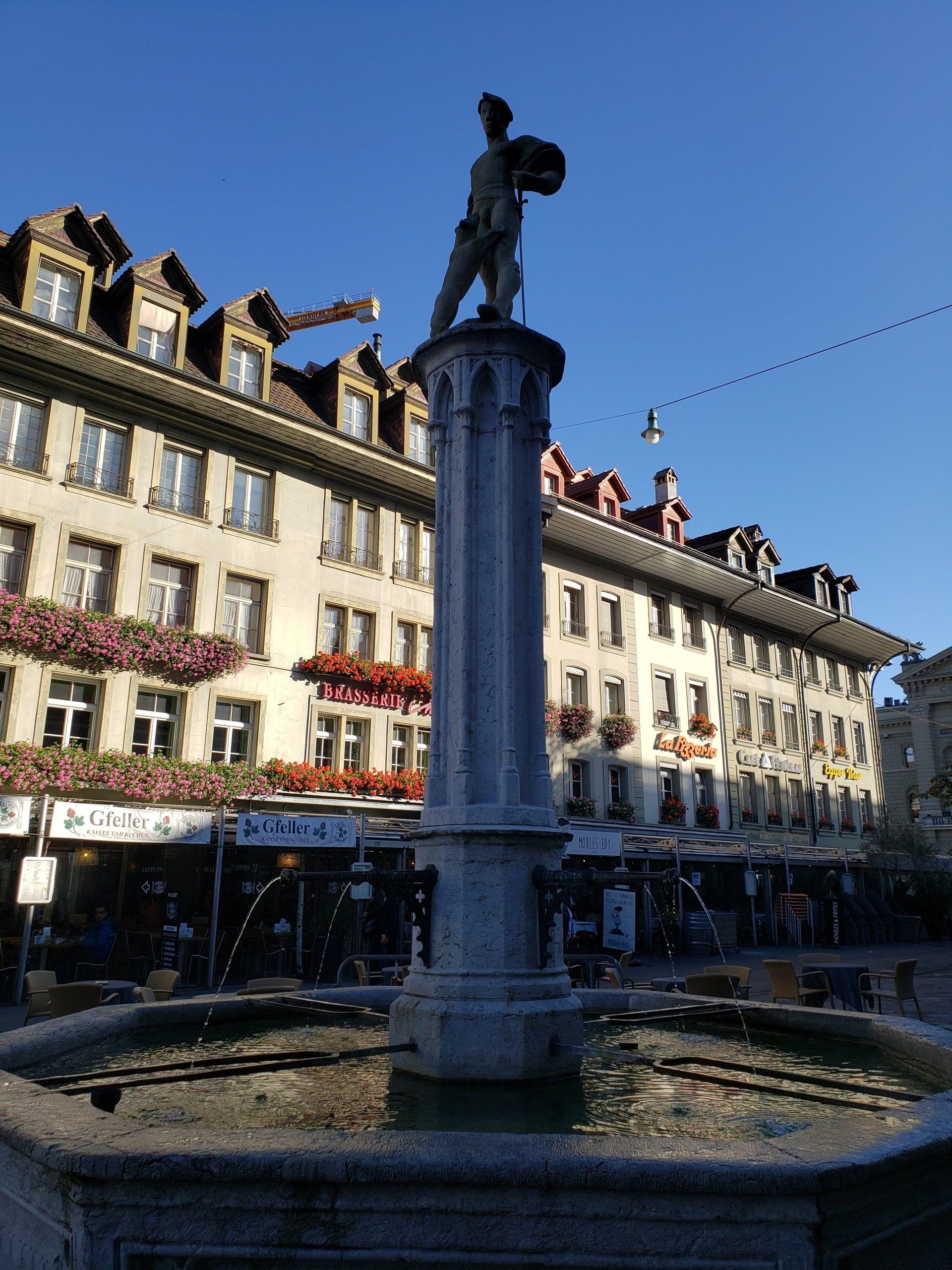 A fountain with a statue of a man on top of it