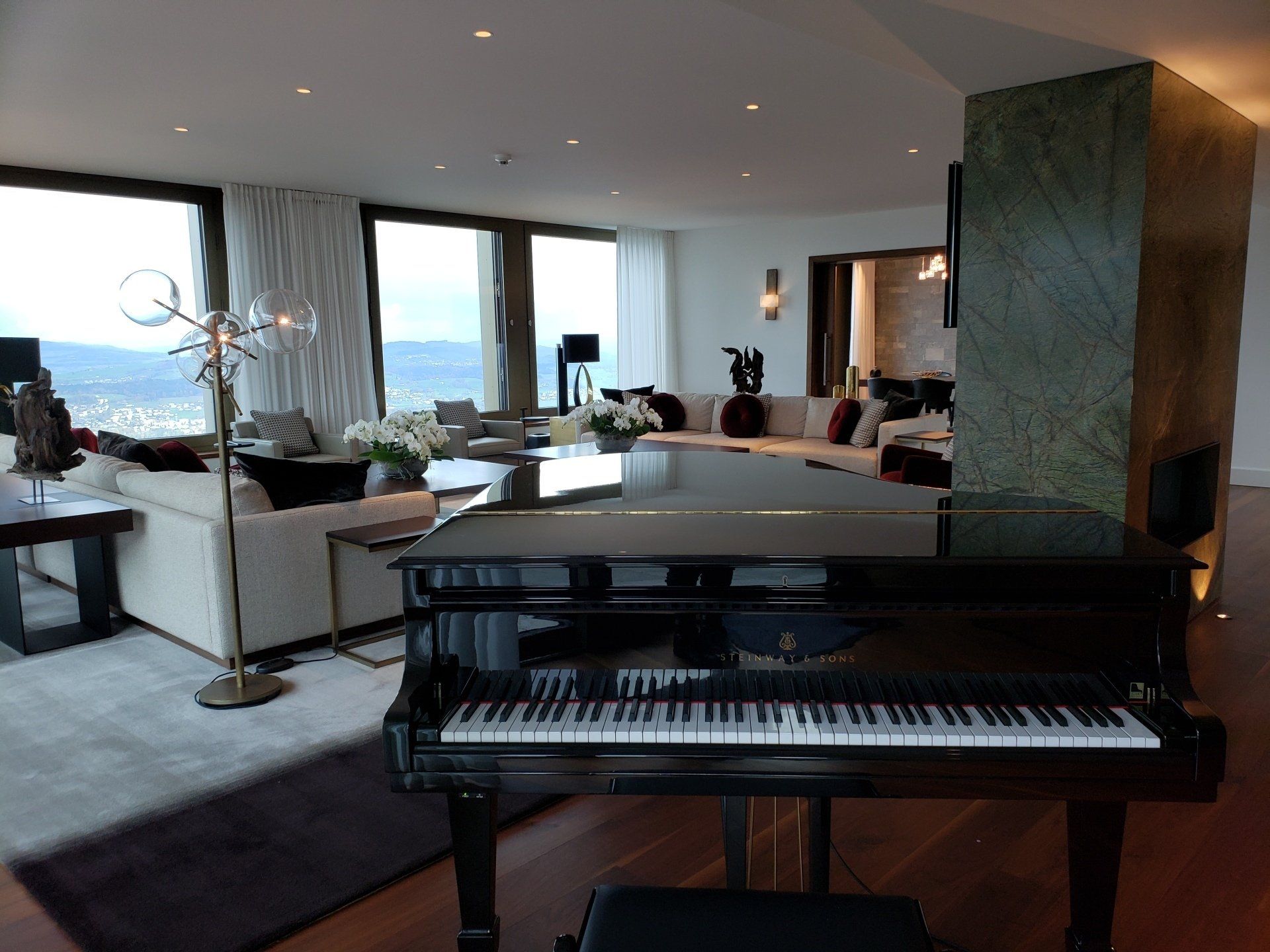 A piano is in the middle of a living room