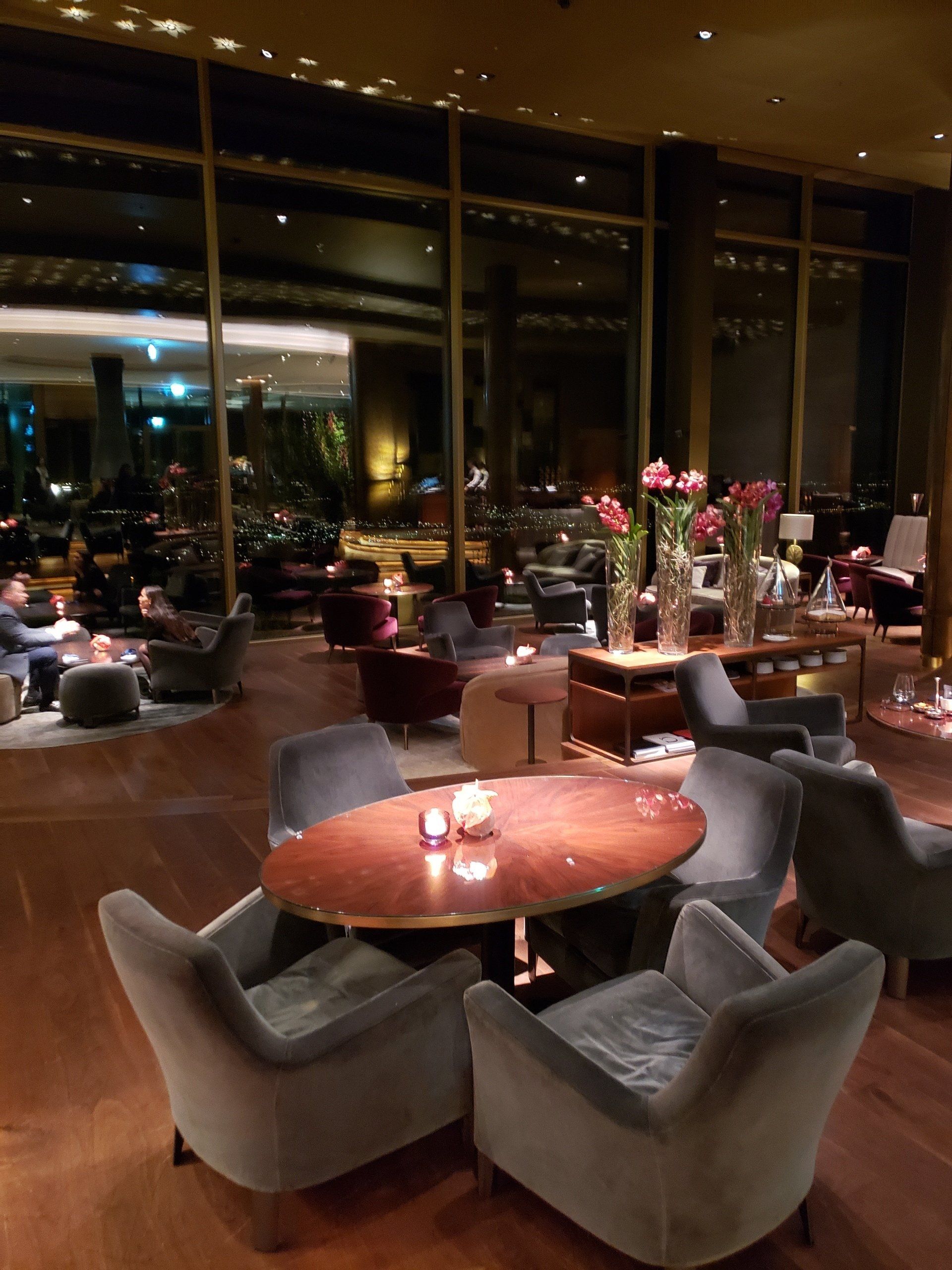 A large room with a table and chairs in it