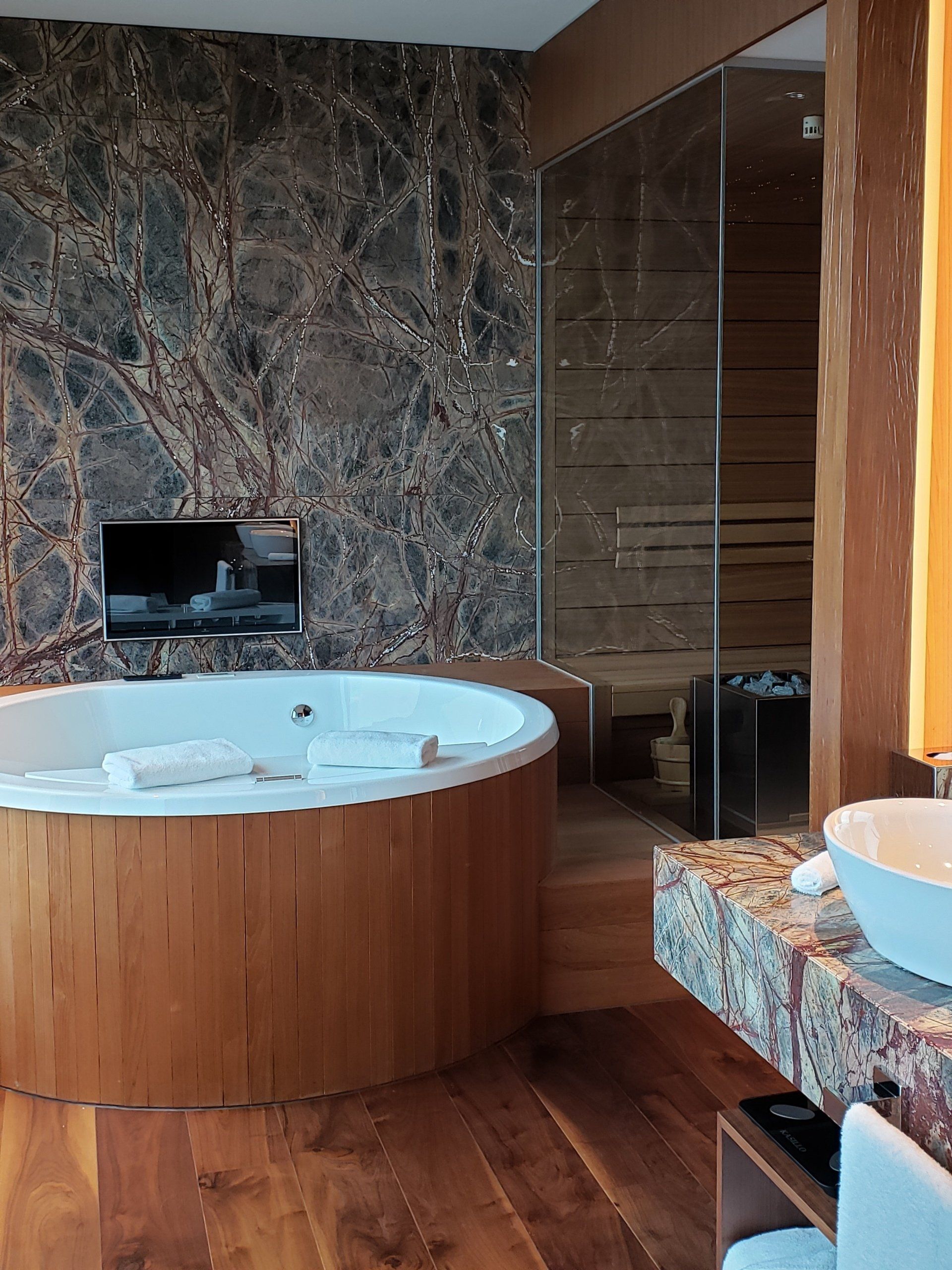 A bathroom with a jacuzzi tub and a sink
