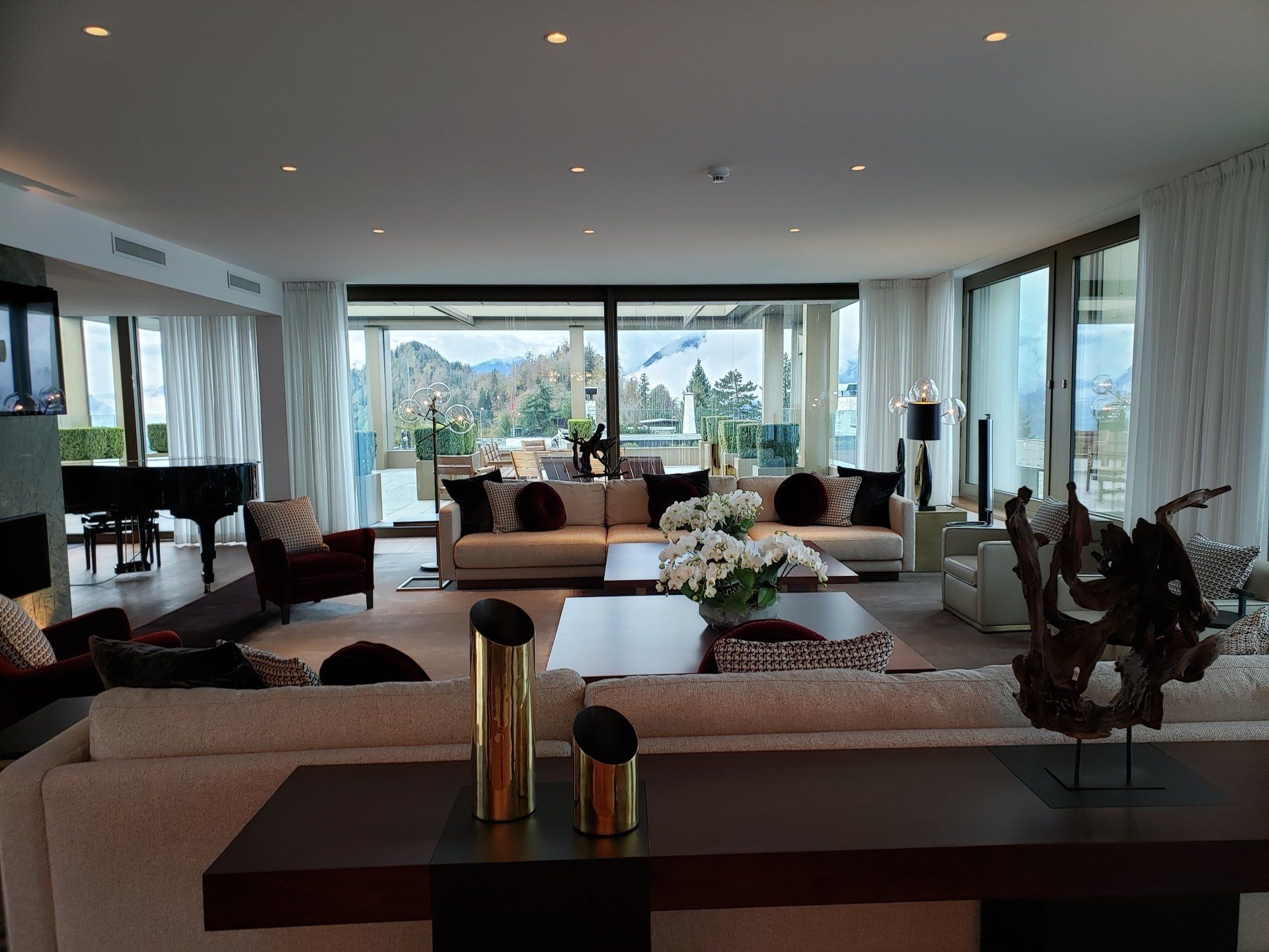 A living room with lots of furniture and a piano