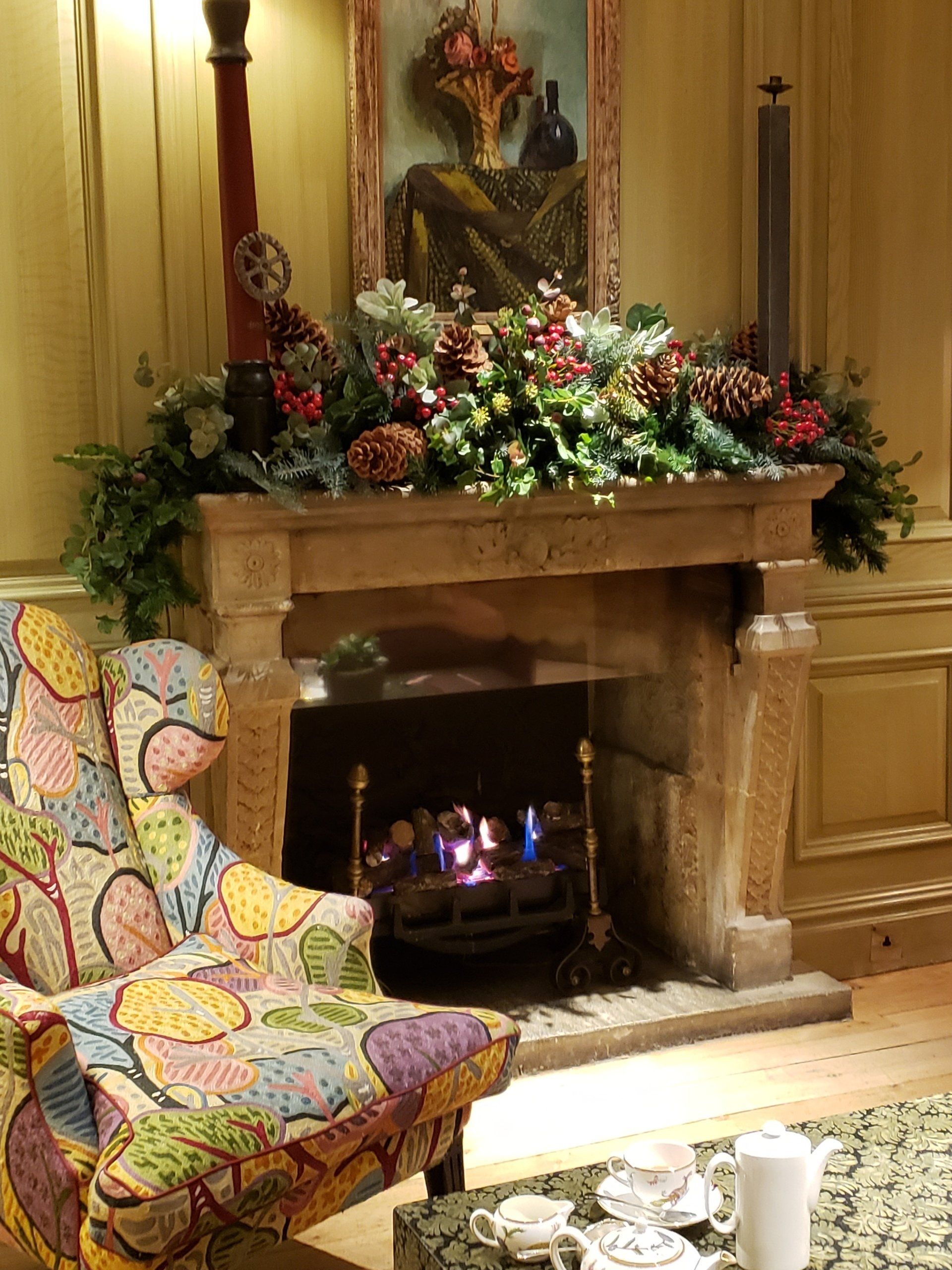 A living room with a fireplace and a chair