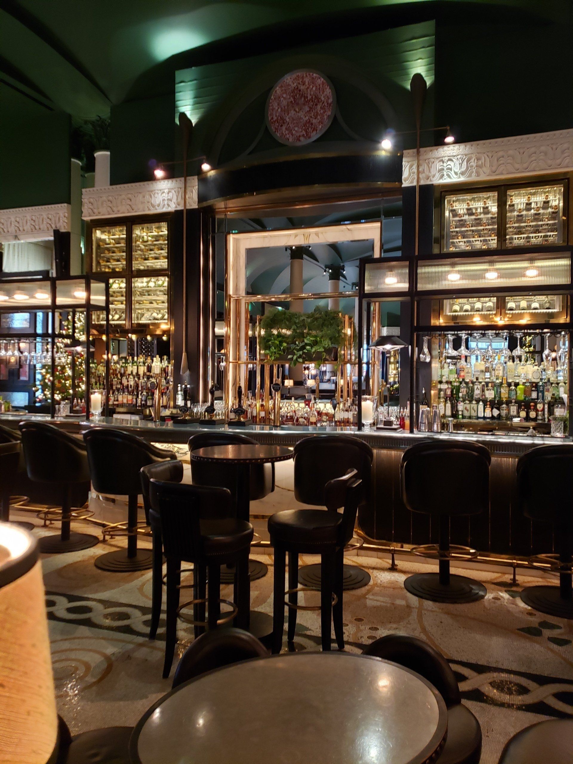 A restaurant with tables and chairs and a bar