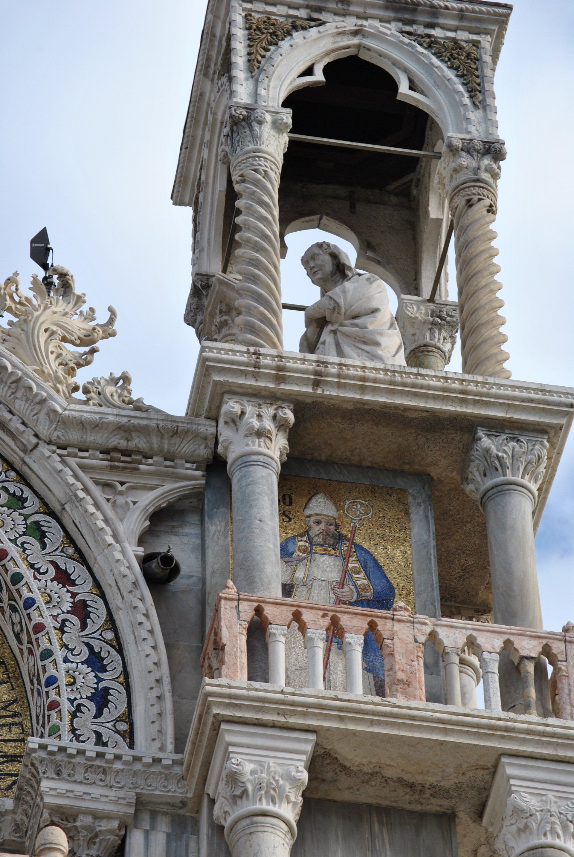 A building with a statue of a man on top of it