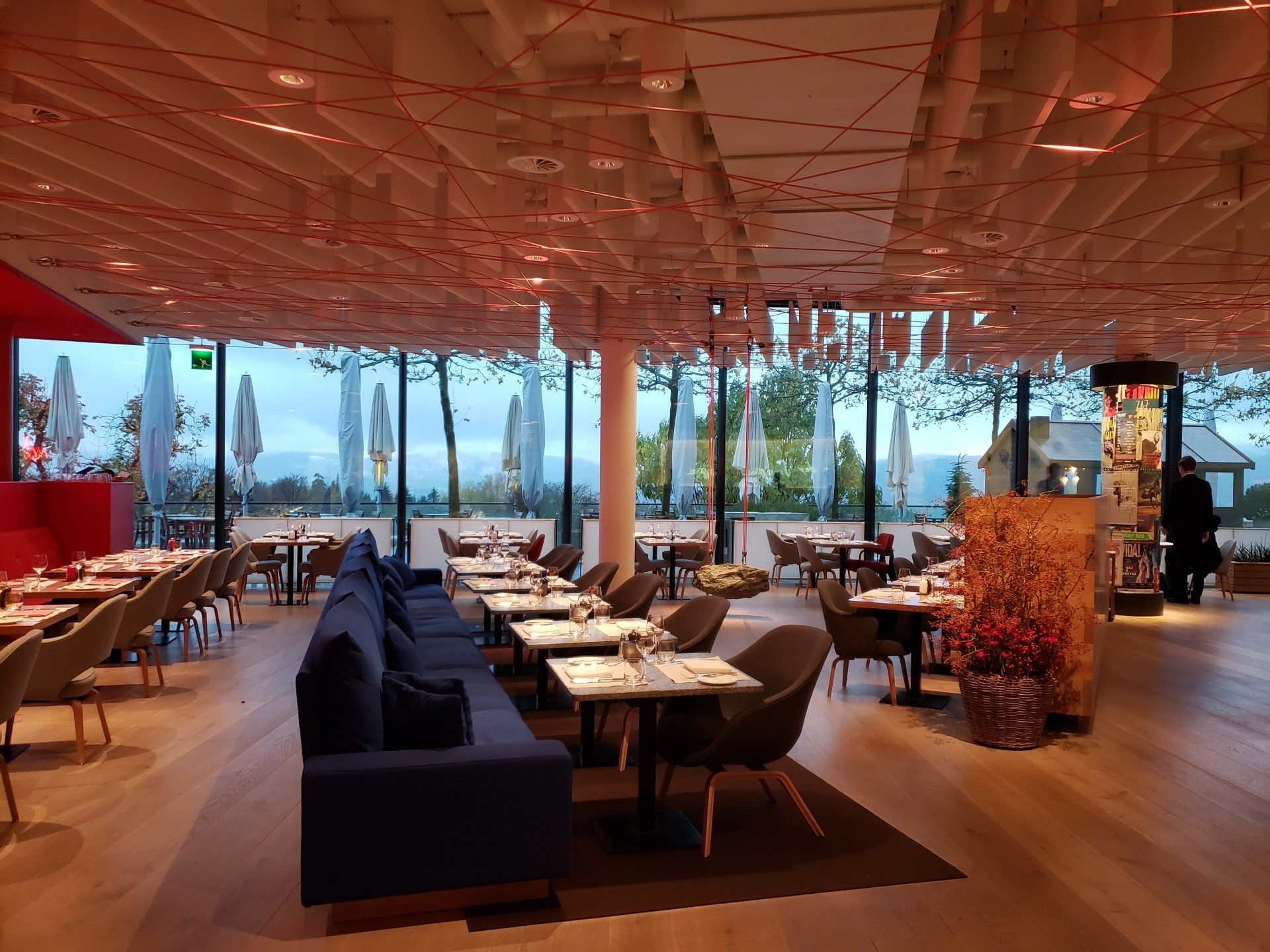 A large room with tables and chairs in a restaurant