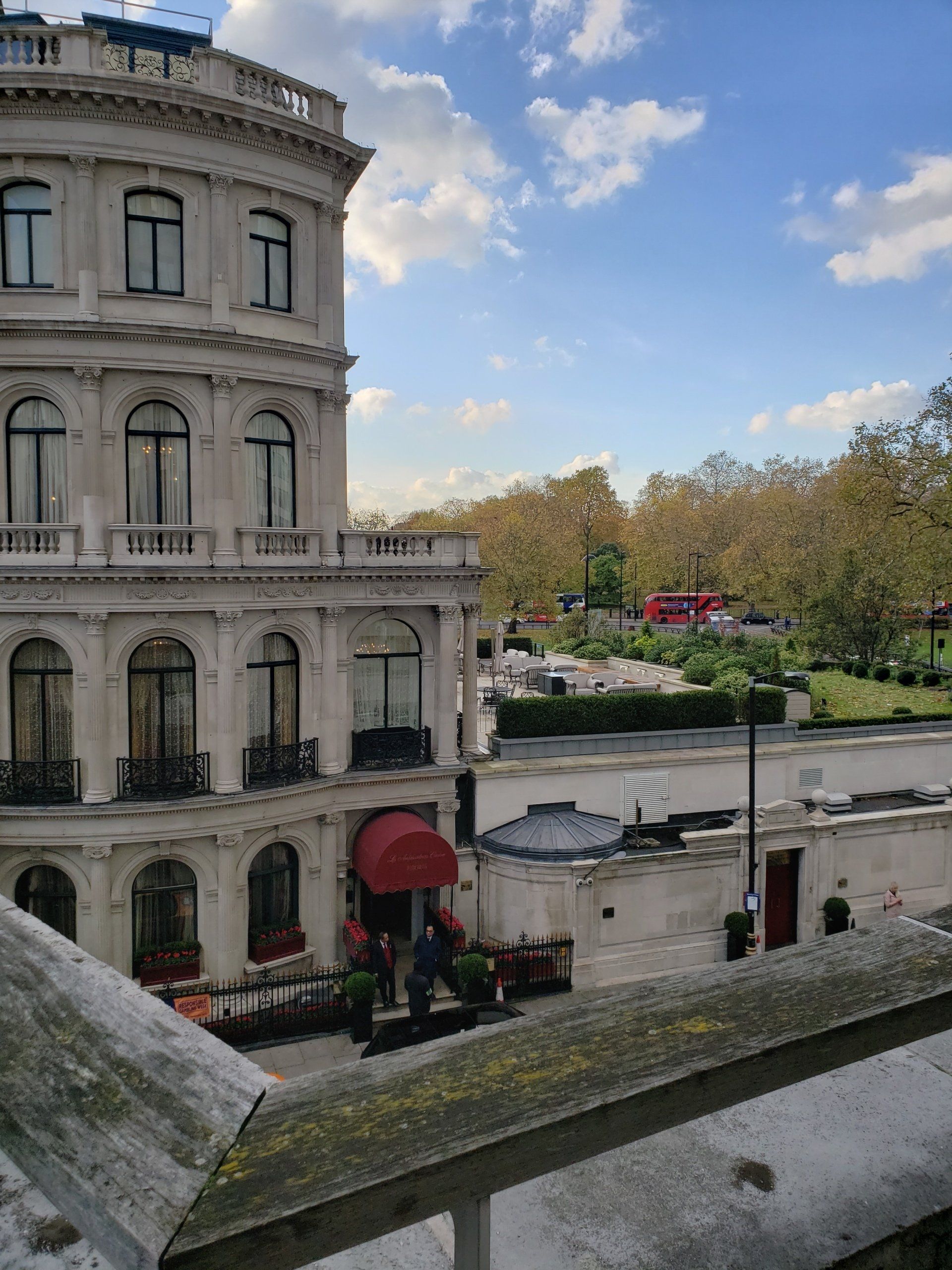 A large building with a red awning on the front of it