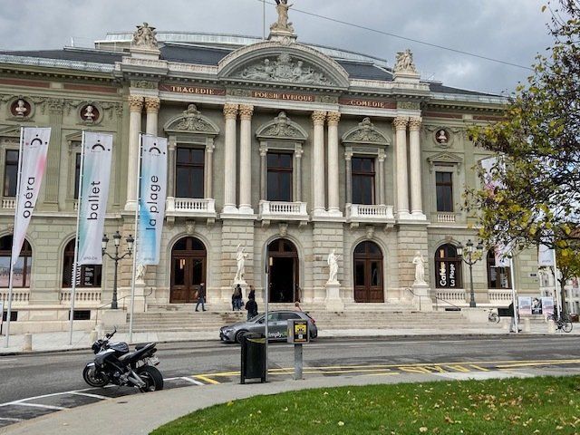A large building with motorcycles parked in front of it