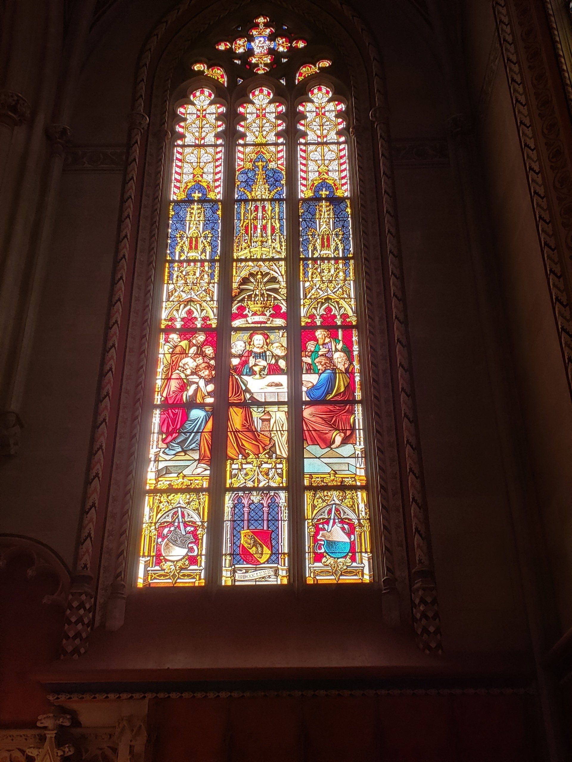 A large stained glass window in a church