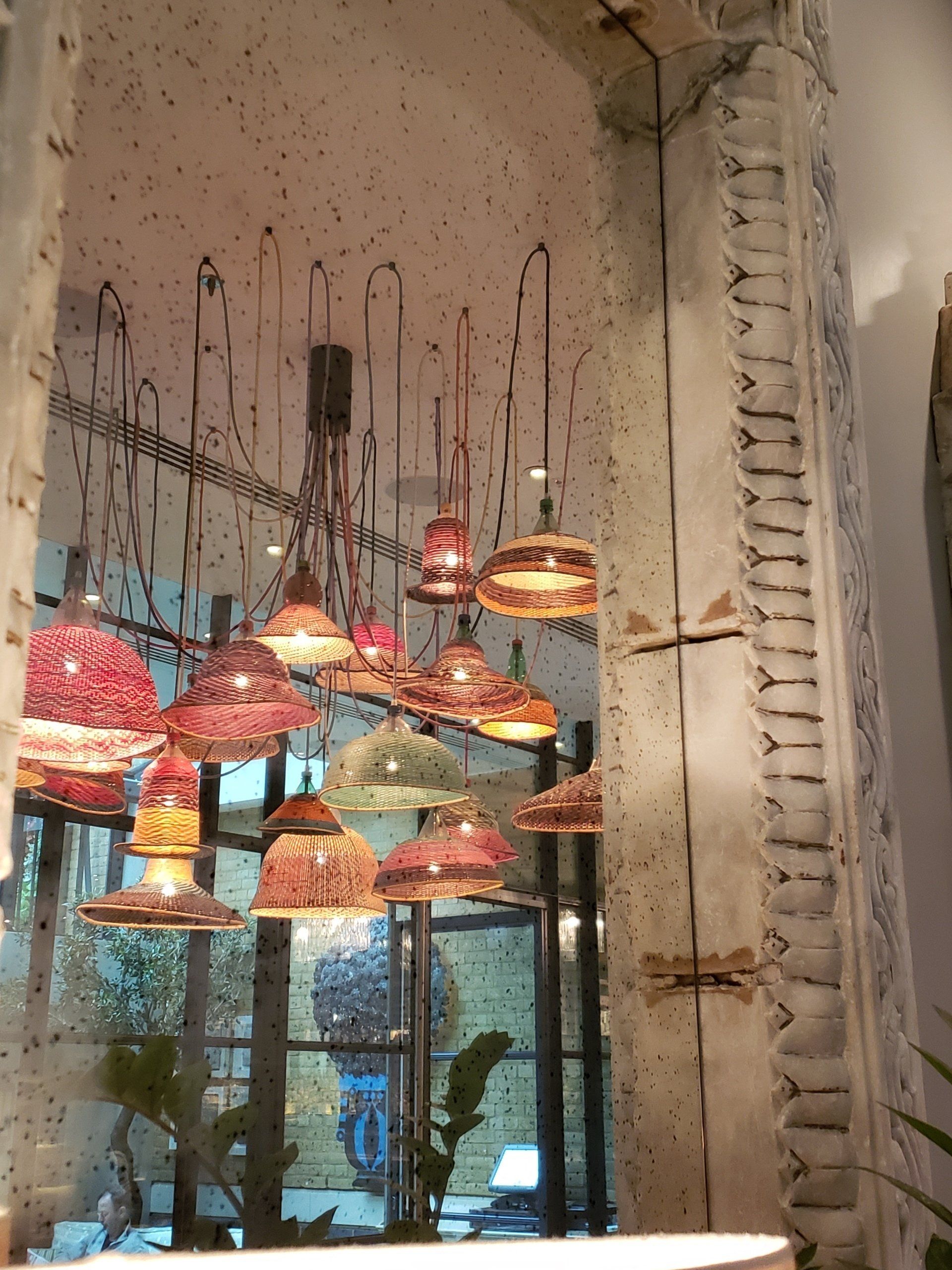 A room with a lot of lights hanging from the ceiling