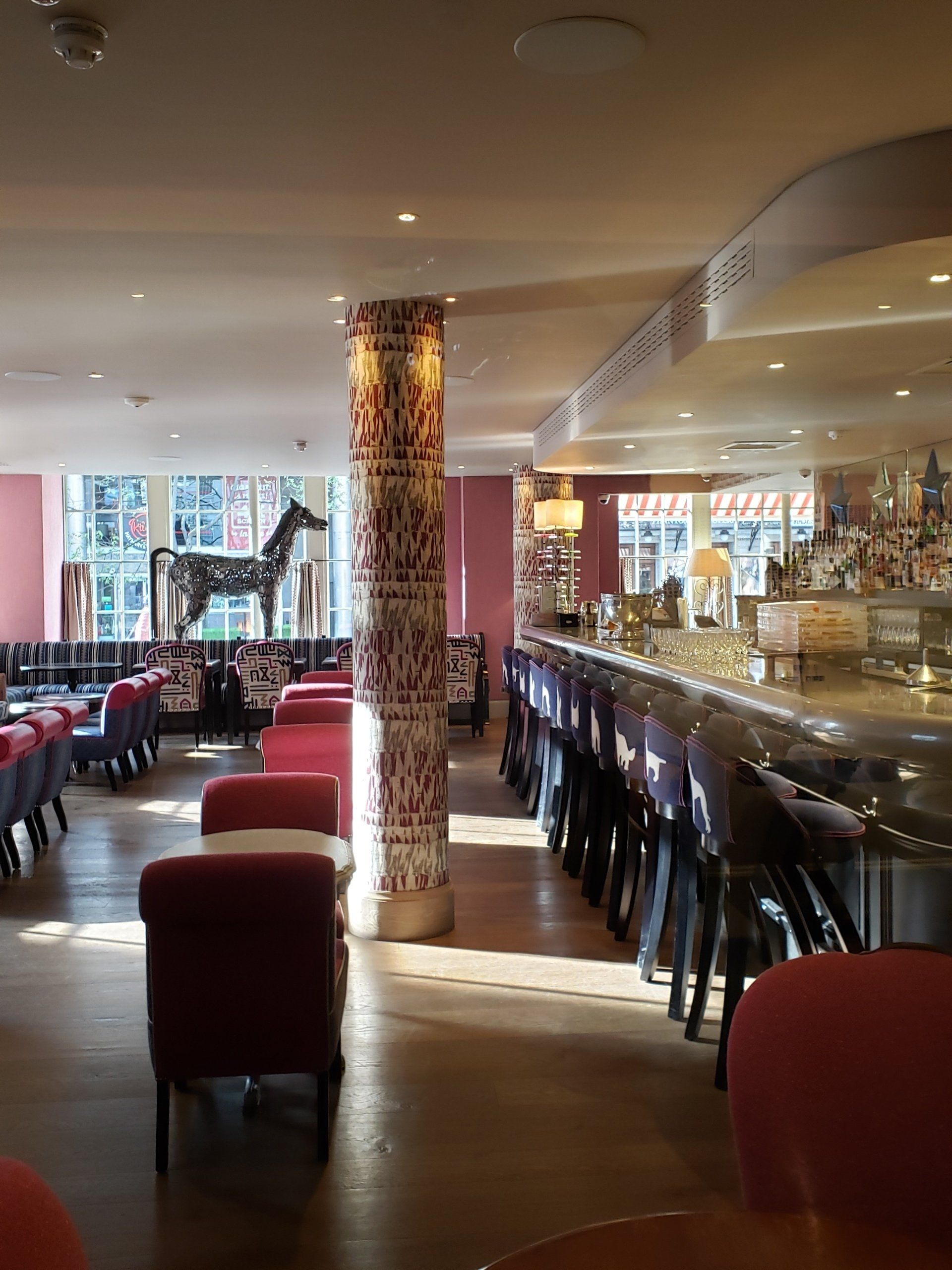 A restaurant with tables and chairs and a bar