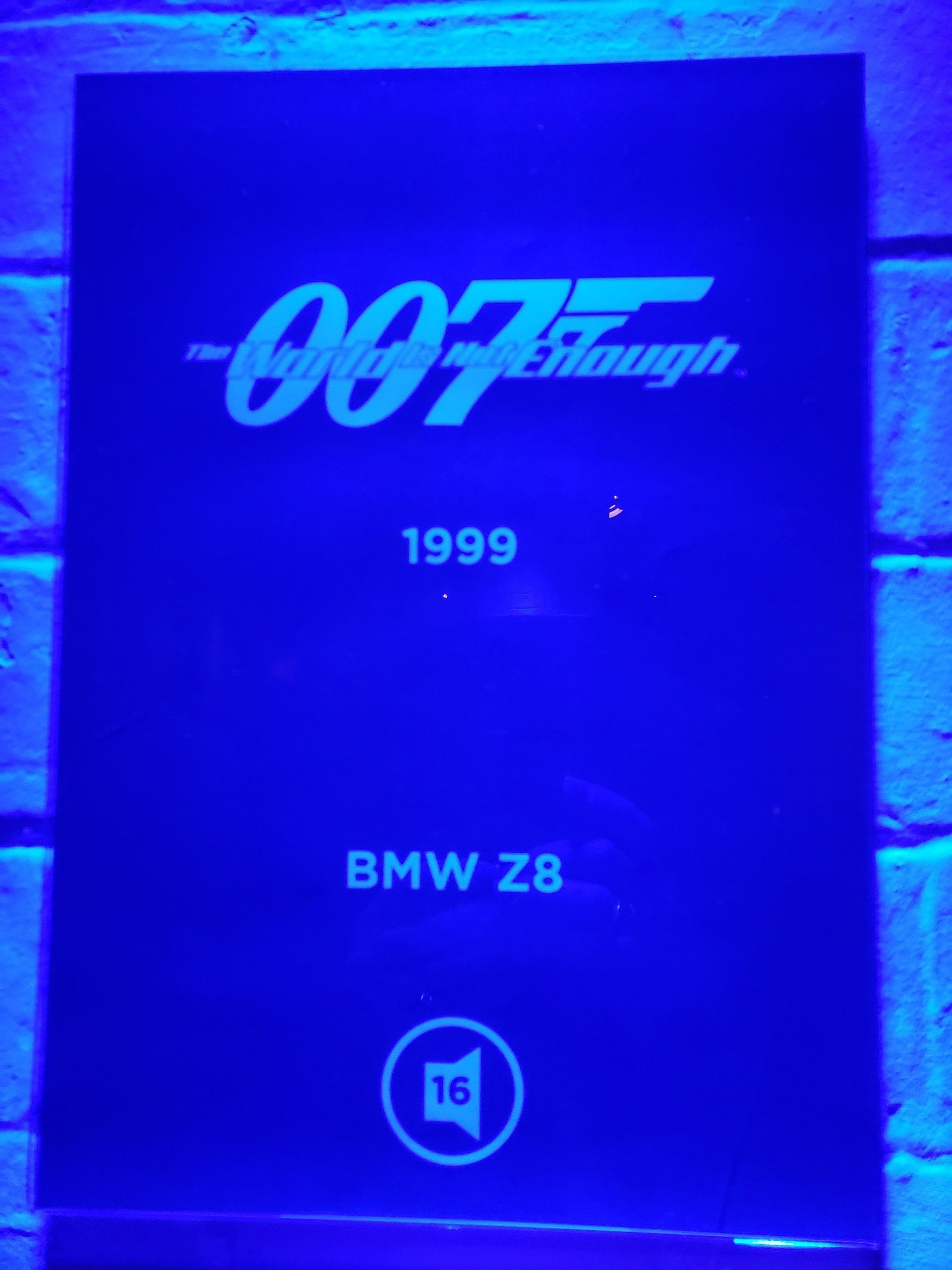 A blue sign that says 007 through 1999 bmw z8