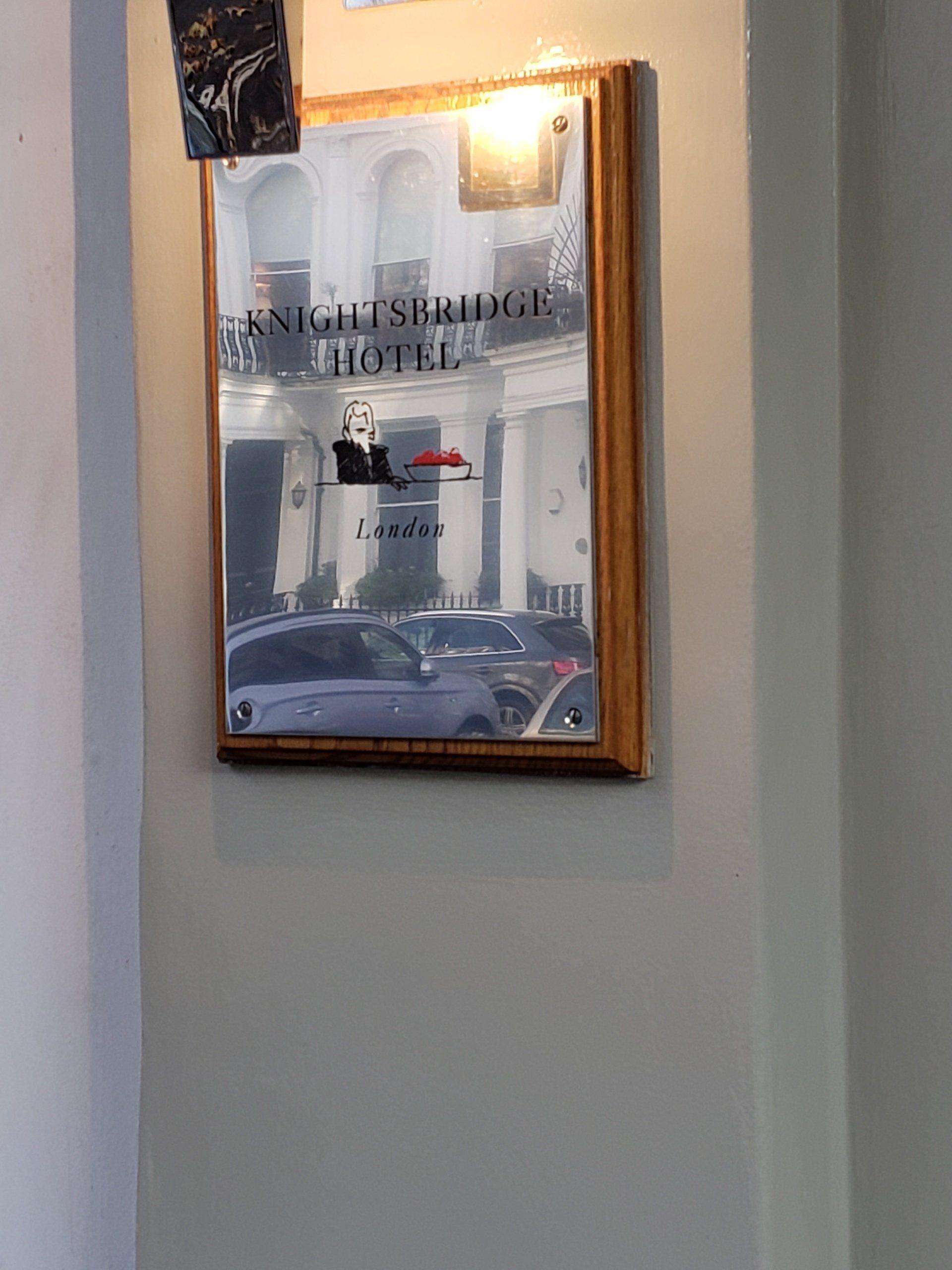 A mirror on a wall that says midnight spring hotel