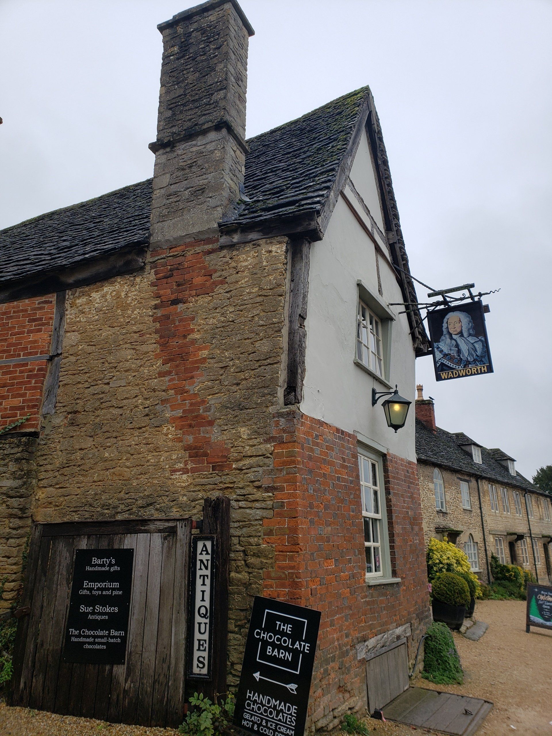 A brick building with a sign that says ' antique ' on it
