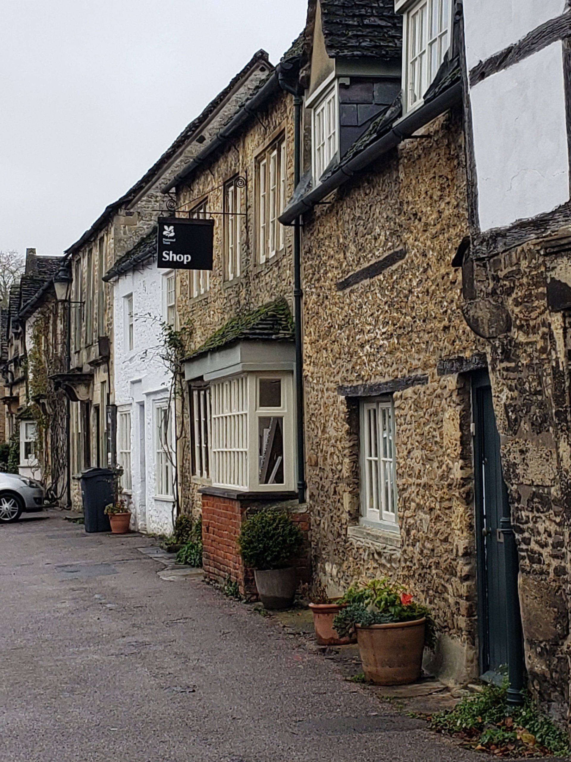 A row of brick buildings with a sign that says ' a ' on it