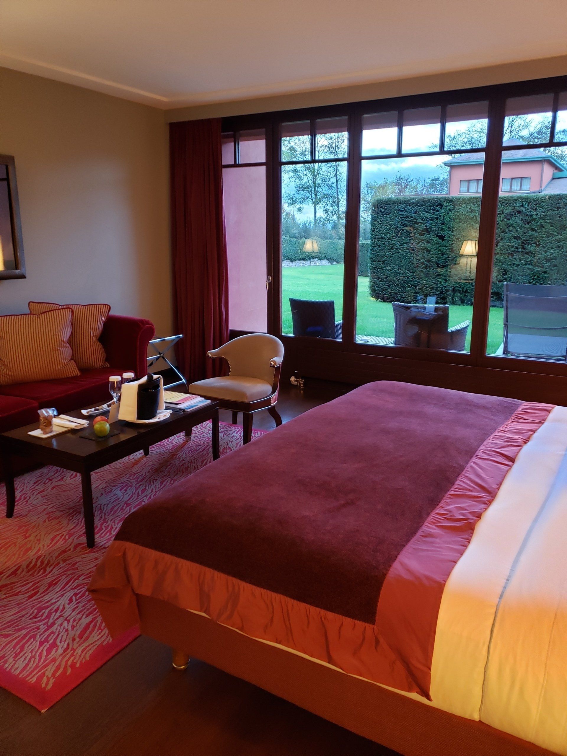 A bedroom with a large bed and a couch