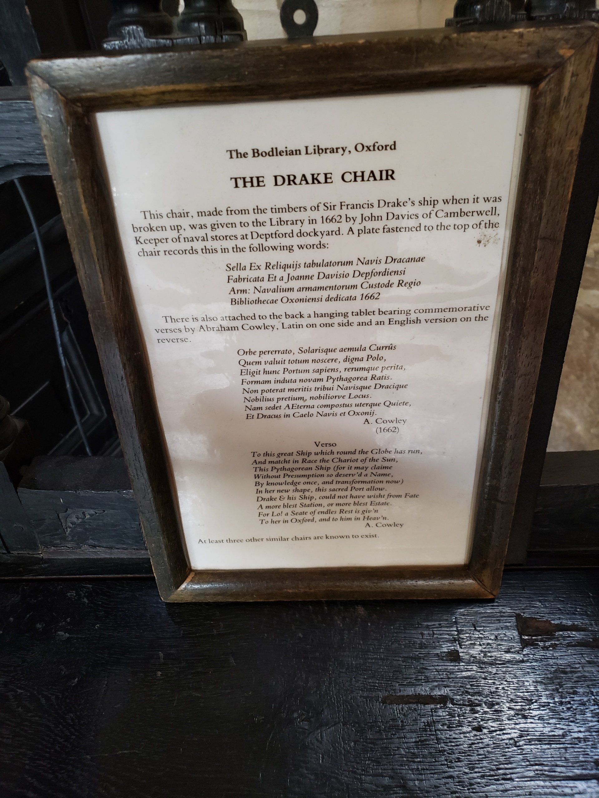 A framed piece of paper that says the drake chair on it