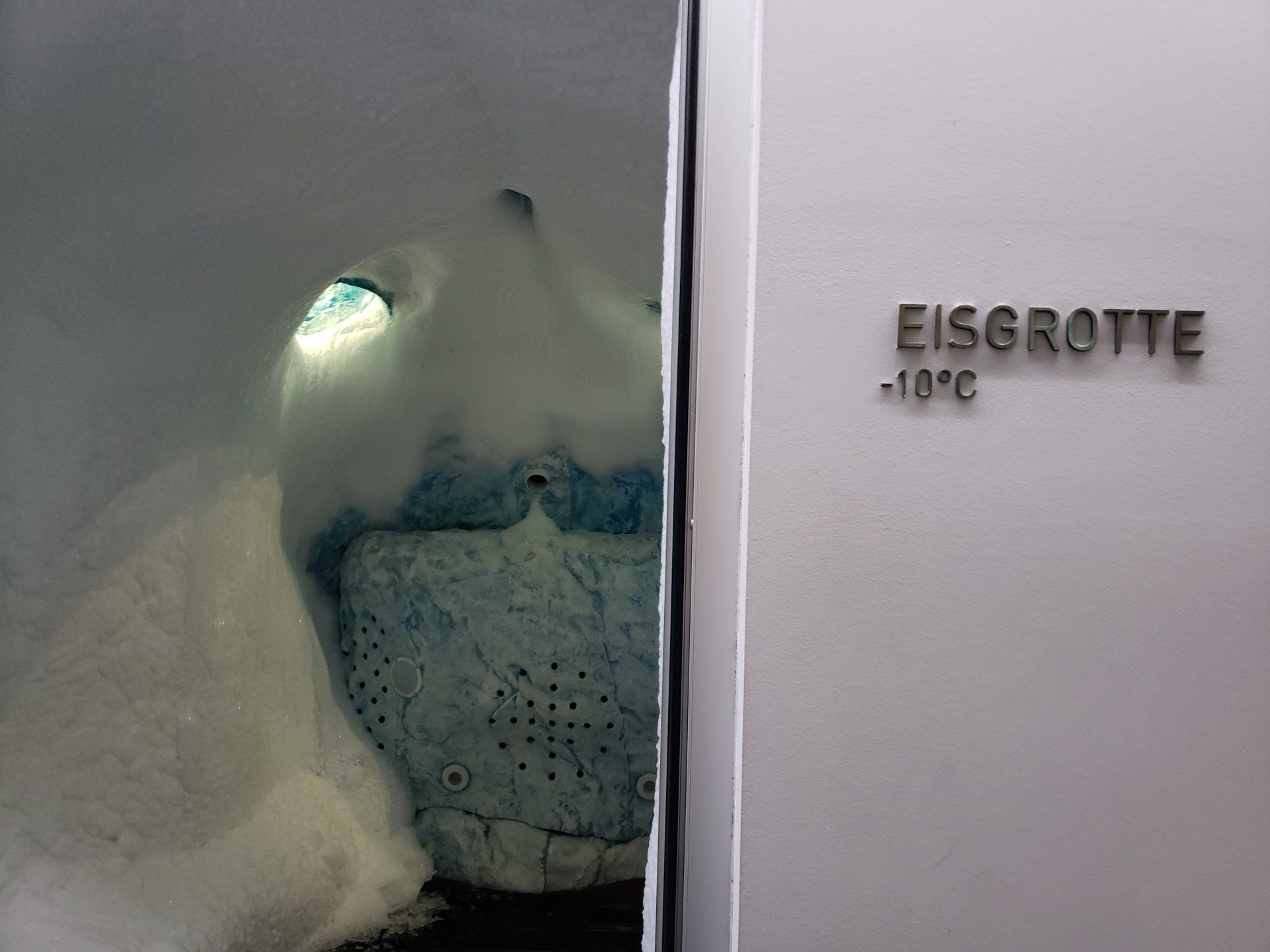 A white door with the word eisgrotte on it