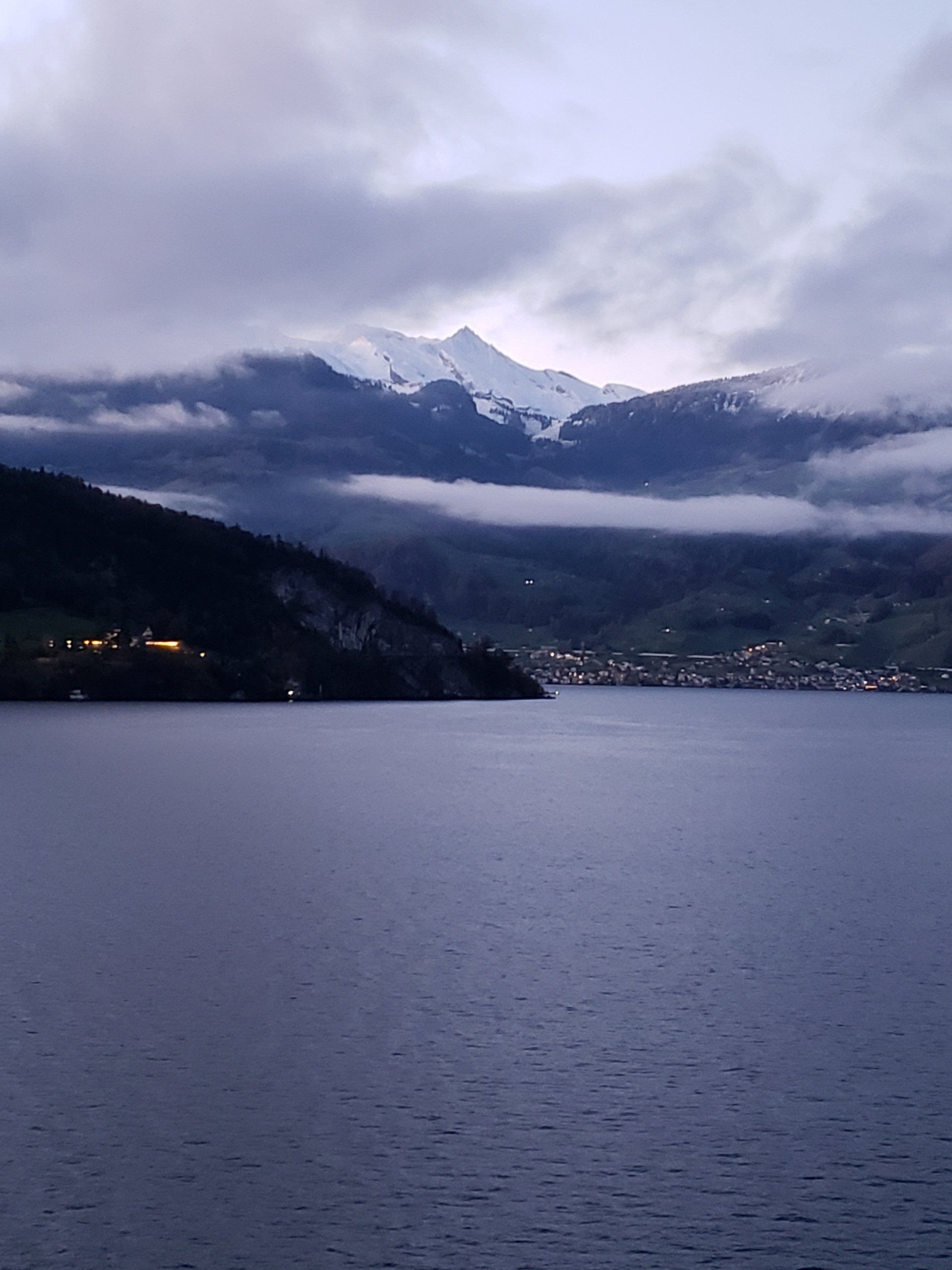 A large body of water with mountains in the background